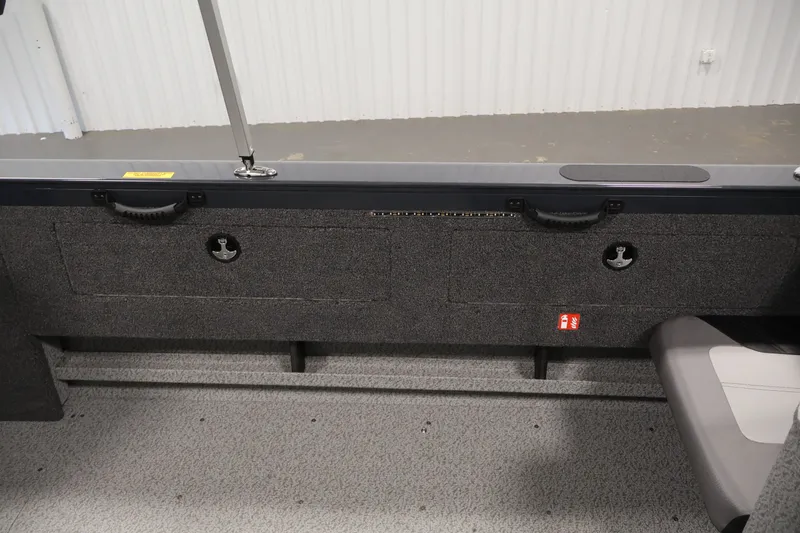 Slide: The Image of Interior view of 2026 Crestliner 2050 Authority boat, featuring storage compartments and seating. - 42