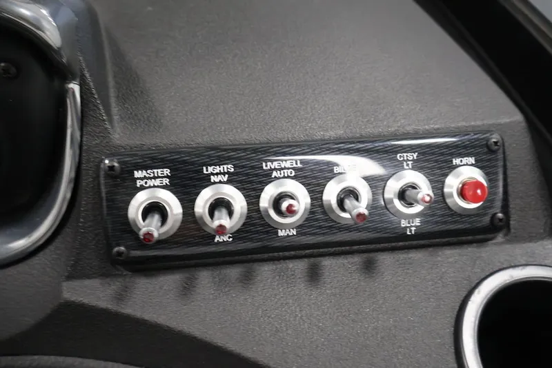 Slide: The Image of Control panel of 2027 Crestliner 2050 Authority boat with switches for various functions. - 34