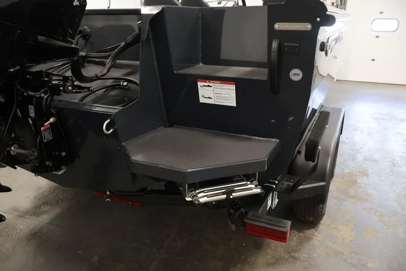 Slide: The Image of Rear view of 2027 Crestliner 2050 Authority boat with motor and step platform. - 61