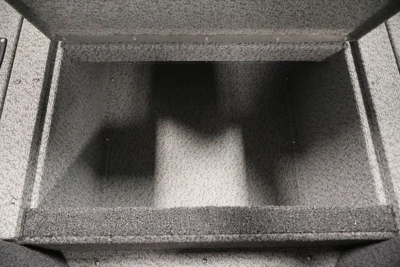 Slide: The Image of Storage compartment of 2027 Crestliner 2050 Authority boat, featuring carpeted interior. - 19