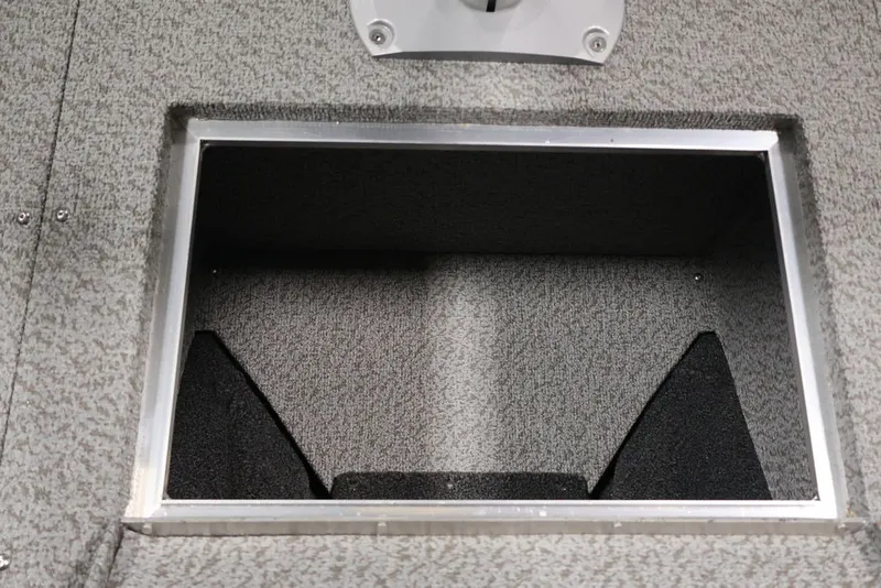 Slide: The Image of Storage compartment in 2027 Crestliner 2050 Authority boat, featuring a textured interior. - 23