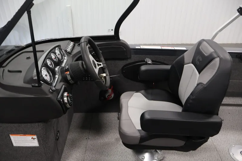 Slide: The Image of Interior of 2027 Crestliner 2050 Authority boat, featuring steering console and captain's chair. - 41