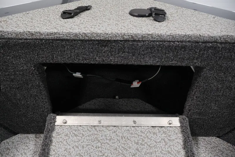 Slide: The Image of Interior storage compartment of 2027 Crestliner 2050 Authority boat, featuring carpeted finish. - 28