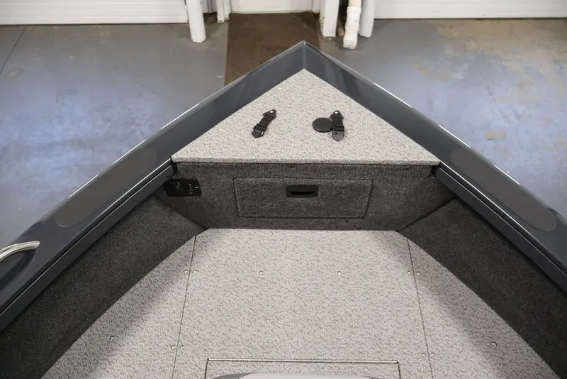 Slide: The Image of 2027 Crestliner 2050 Authority boat interior, featuring carpeted storage area and sleek design. - 25