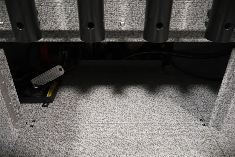 Slide: The Image of Interior storage compartment of 2027 Crestliner 2050 Authority boat, featuring rod holders. - 39