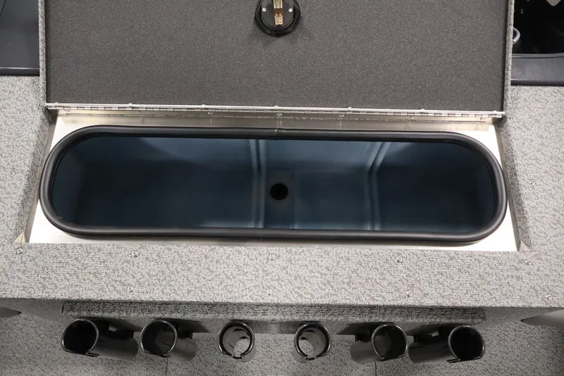 Slide: The Image of Livewell compartment in 2027 Crestliner 2050 Authority boat, featuring rod holders and storage. - 47