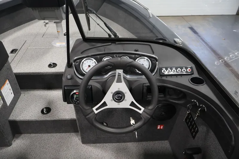 Slide: The Image of 2027 Crestliner 2050 Authority boat dashboard with steering wheel and instrument panel. - 59