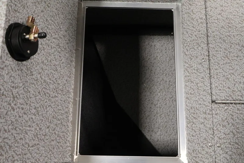 Slide: The Image of Interior compartment of 2027 Crestliner 2050 Authority boat, featuring a storage hatch. - 26