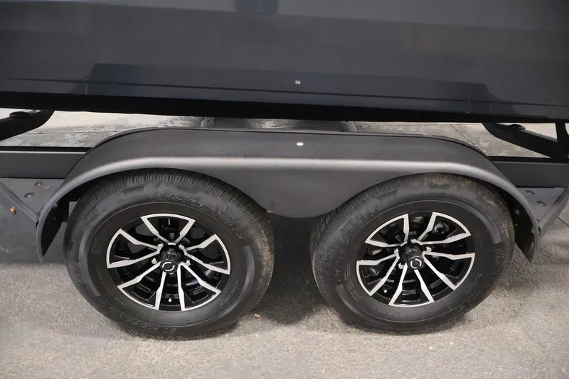 Slide: The Image of Trailer wheels of a 2027 Crestliner 2050 Authority boat. - 63