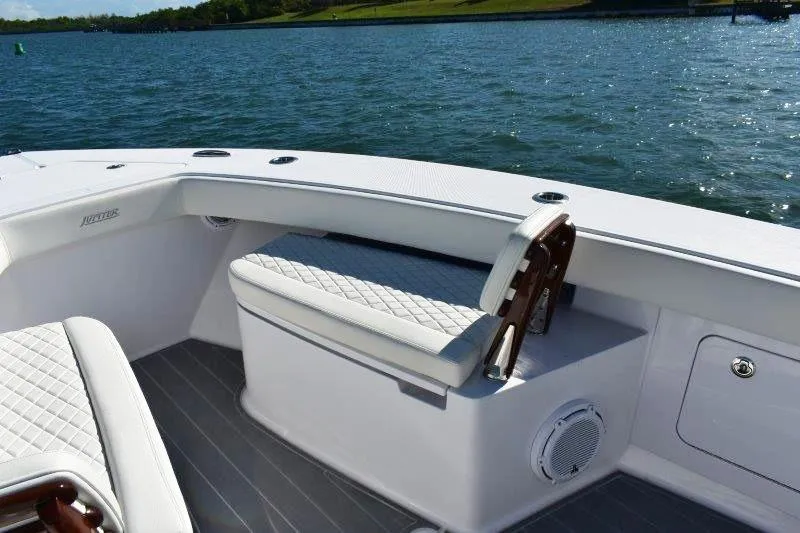 Slide: The Image of Luxurious seating on 2025 Jupiter 32 FS boat, overlooking serene water. - 13