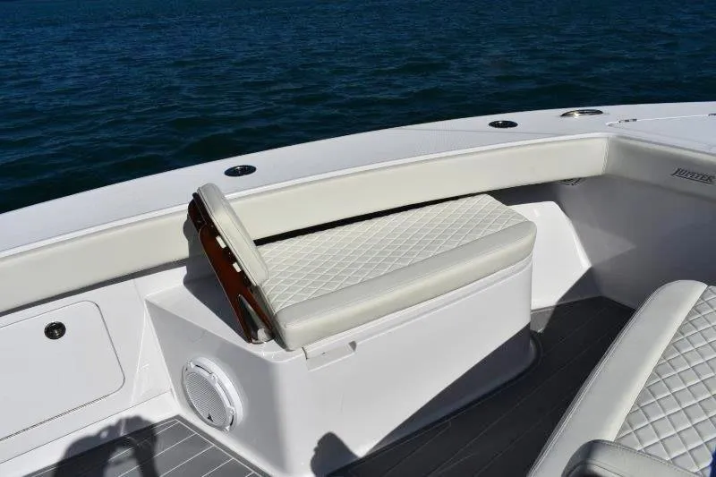 Slide: The Image of Luxury seating on 2025 Jupiter 32 FS boat, featuring diamond-stitched upholstery. - 15