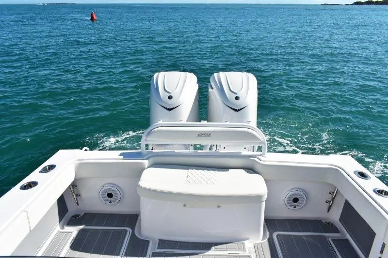 Slide: The Image of 2025 Jupiter 32 FS boat with dual engines on open water. - 3