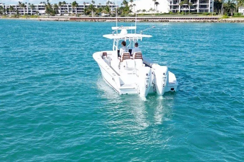 Slide: The Image of 2025 Jupiter 32 FS boat cruising on clear blue water near a coastal area. - 4