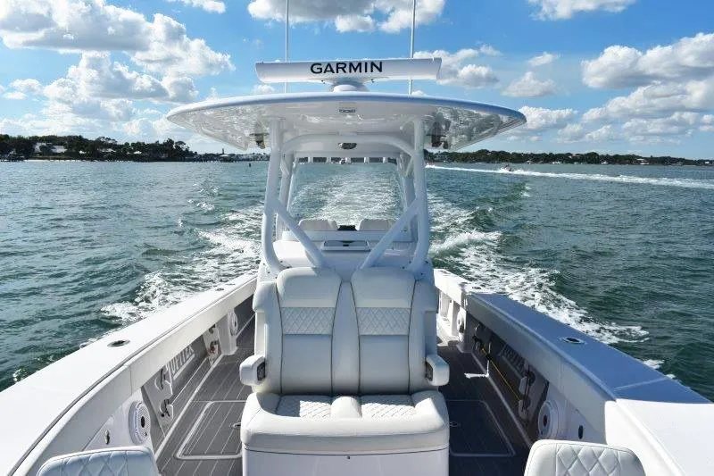 Slide: The Image of 2025 Jupiter 32 FS boat cruising on open water under a clear blue sky. - 6