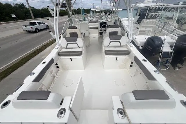Slide: The Image of 2017 World Cat 255 DC boat interior with seating and dual consoles. - 10