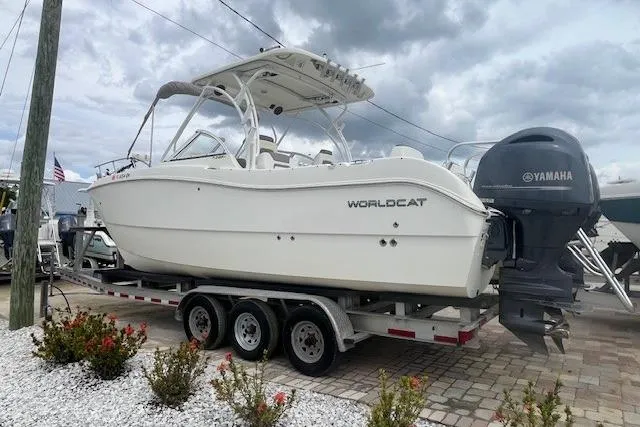 Slide: The Image of 2017 World Cat 255 DC boat on trailer with Yamaha engine, parked outdoors. - 3
