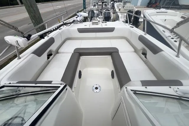 Slide: The Image of 2017 World Cat 255 DC boat interior with spacious seating and modern design. - 4