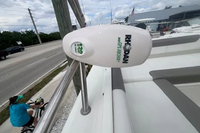 Slide: The Image of Rhoden GPS anchor on 2017 World Cat 255 DC boat, parked near a road. - 5