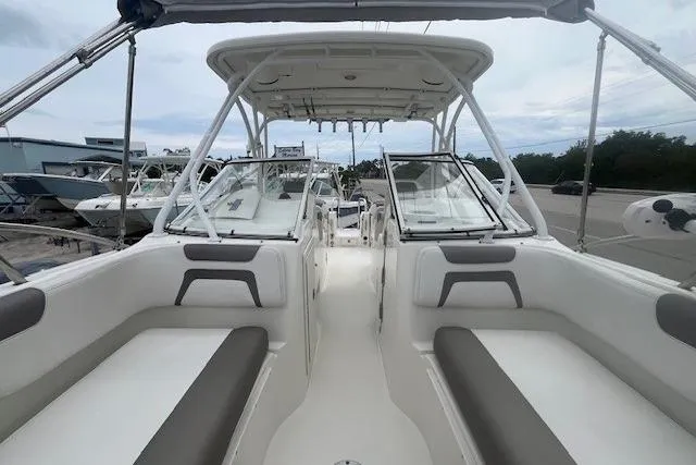 Slide: The Image of 2017 World Cat 255 DC boat interior with seating and canopy. - 6