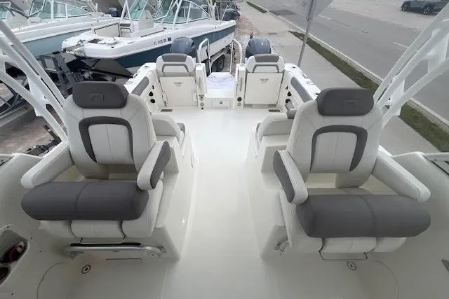 Slide: The Image of 2017 World Cat 255 DC boat interior with four cushioned seats and sleek design. - 9