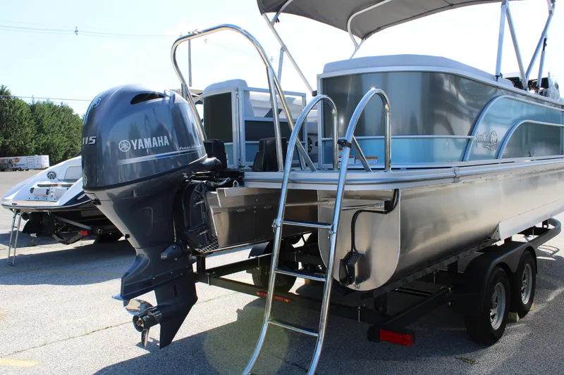 Slide: The Image of 2024 SunCatcher Select 22RC pontoon boat with Yamaha 115 engine on trailer. - 6
