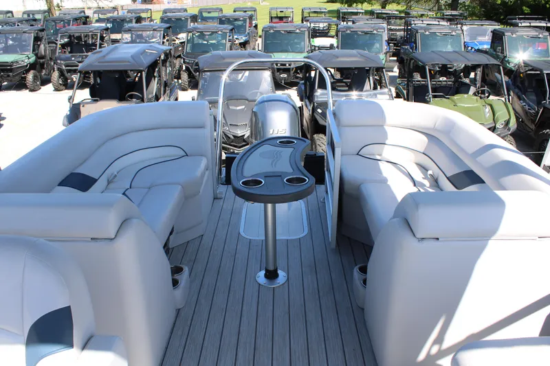 Slide: The Image of 2024 SunCatcher Select 22RC pontoon boat interior with plush seating and cup holders. - 8