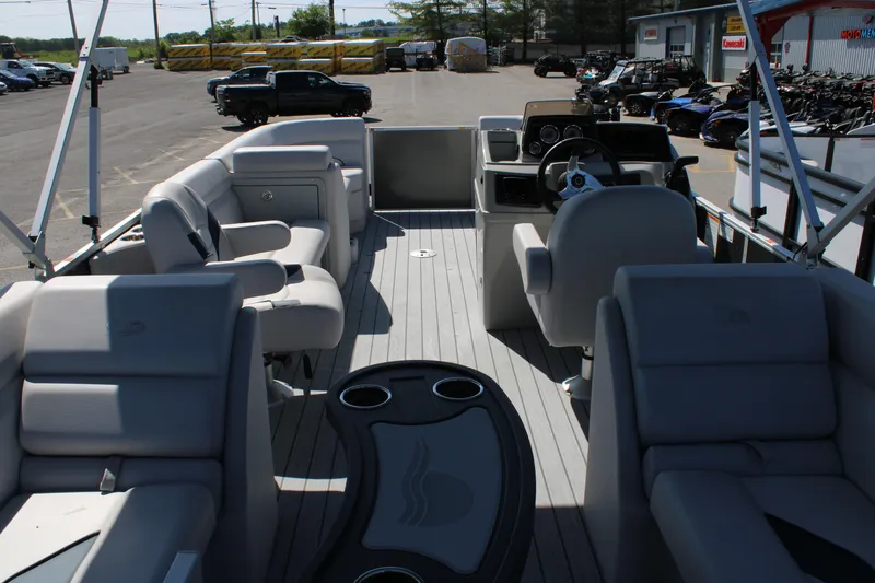 Slide: The Image of 2024 SunCatcher Select 22RC pontoon boat interior with seating and steering console. - 9