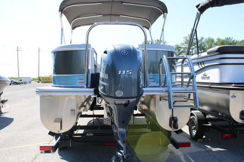 Slide: The Image of 2024 SunCatcher Select 22RC pontoon boat with Yamaha 115 engine, parked outdoors. - 5