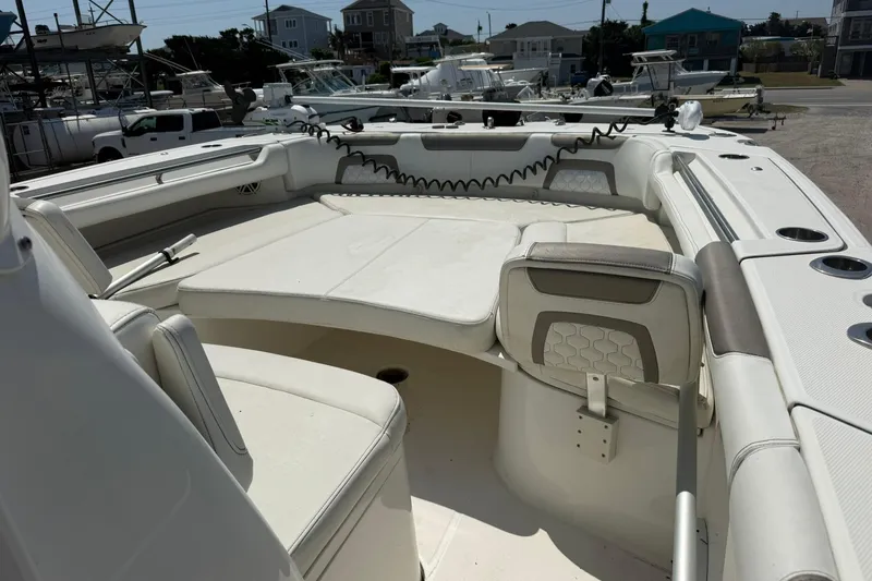 Slide: The Image of 2020 World Cat 325 CC boat interior with spacious seating and modern design. - 10