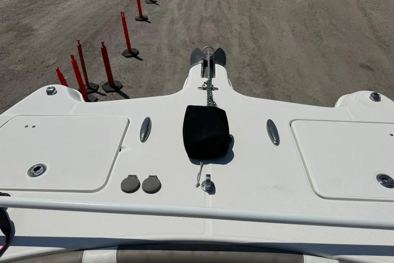 Slide: The Image of Bow view of 2020 World Cat 325 CC boat on dry land with red markers. - 11