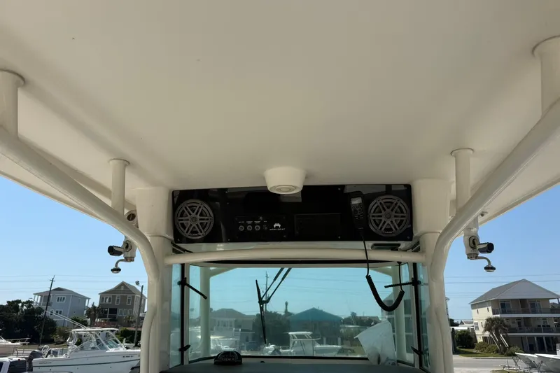 Slide: The Image of 2020 World Cat 325 CC boat interior with speakers and control panel. - 19