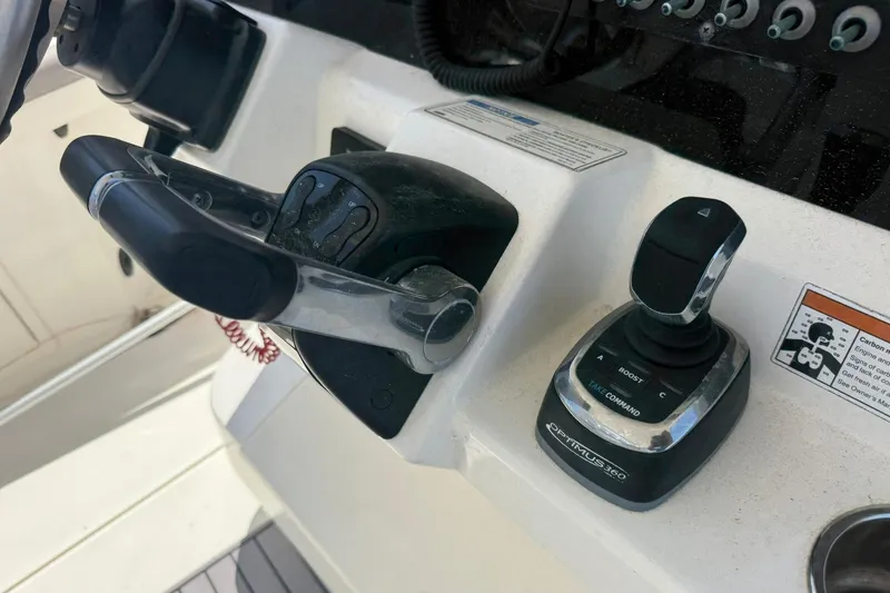 Slide: The Image of Control panel of a 2020 World Cat 325 CC boat with joystick and throttle. - 20