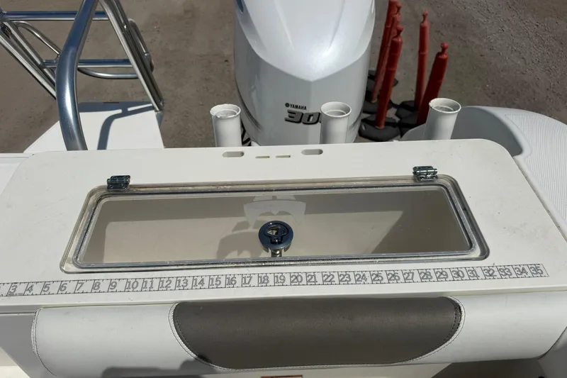 Slide: The Image of 2020 World Cat 325 CC boat with Yamaha 300 engine, featuring a built-in measuring ruler. - 27