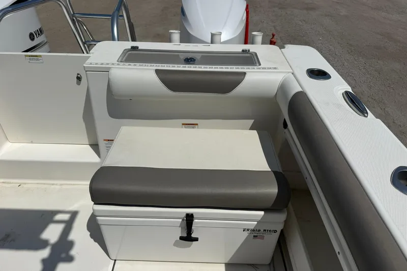 Slide: The Image of 2020 World Cat 325 CC boat interior with seating and storage compartment. - 28