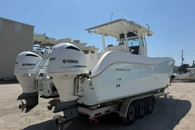 Slide: The Image of 2020 World Cat 325 CC boat with twin Yamaha engines on a trailer. - 4