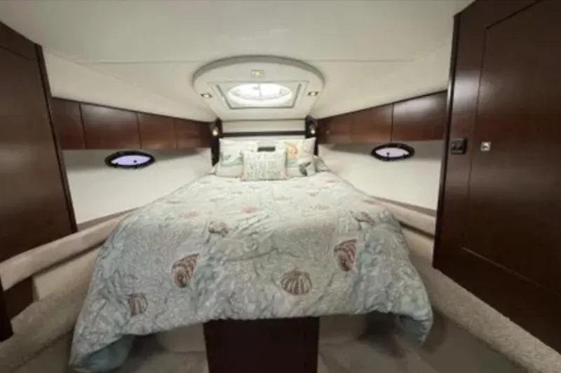 Slide: The Image of Luxurious cabin interior of 2012 Cruisers Yachts 350 Express with elegant bedding. - 10