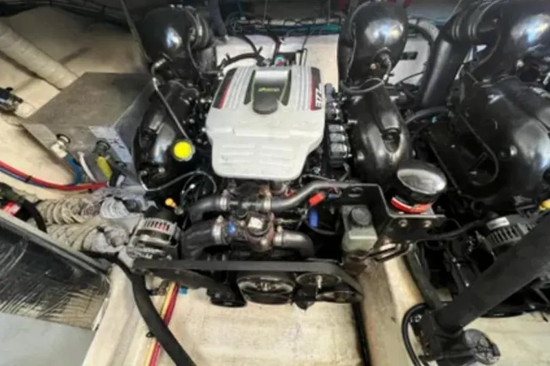 Slide: The Image of Engine compartment of a 2012 Cruisers Yachts 350 Express, showcasing mechanical components. - 13