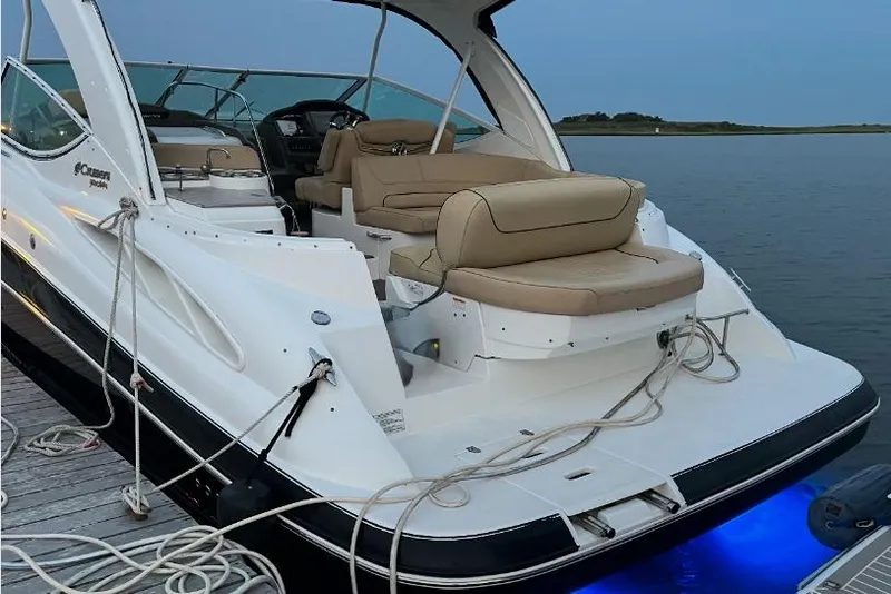 Slide: The Image of 2012 Cruisers Yachts 350 Express docked, showcasing luxurious seating and sleek design. - 5