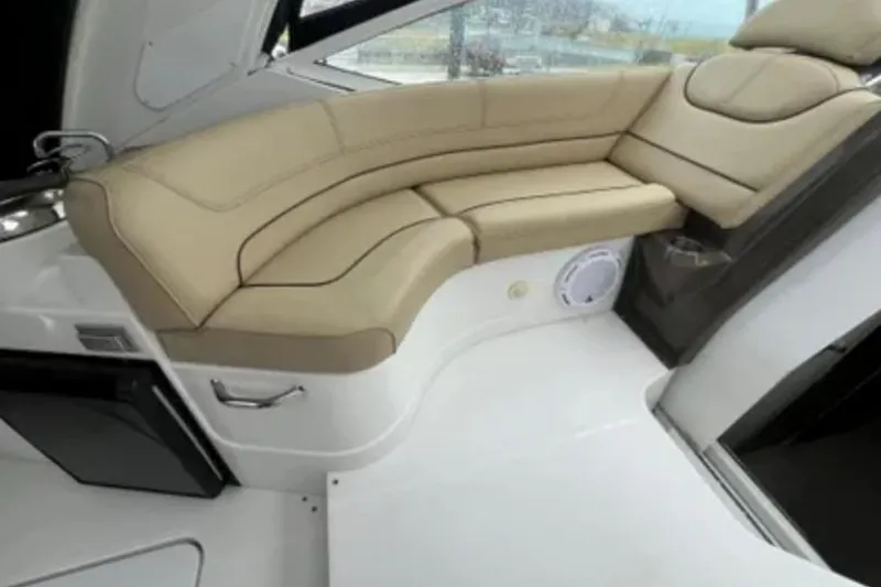 Slide: The Image of Luxurious interior seating of 2012 Cruisers Yachts 350 Express with beige upholstery. - 8