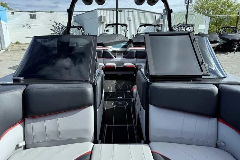 Slide: The Image of 2022 Supra SE boat interior with sleek seating and modern design elements. - 11