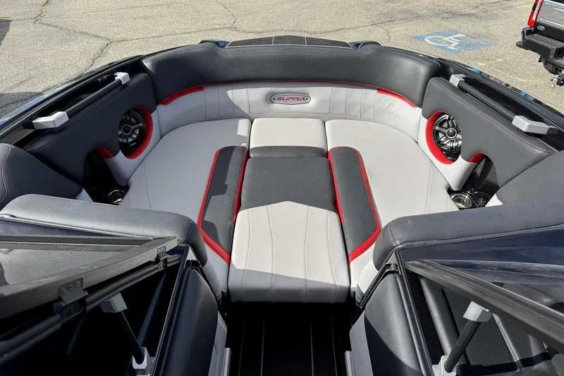 Slide: The Image of 2022 Supra SE boat interior with stylish seating and audio system. - 12