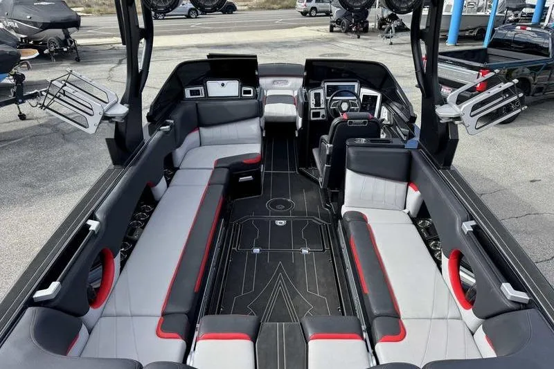 Slide: The Image of 2022 Supra SE boat interior with sleek seating and modern dashboard design. - 13