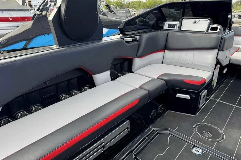 Slide: The Image of 2022 Supra SE boat interior with sleek seating and modern design elements. - 15