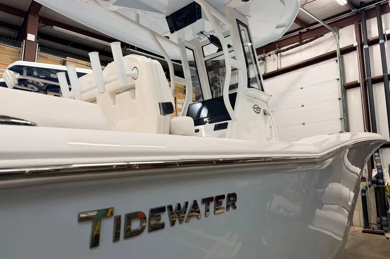 Slide: The Image of 2026 Tidewater 232 LXF boat in showroom, showcasing sleek design and modern features. - 6