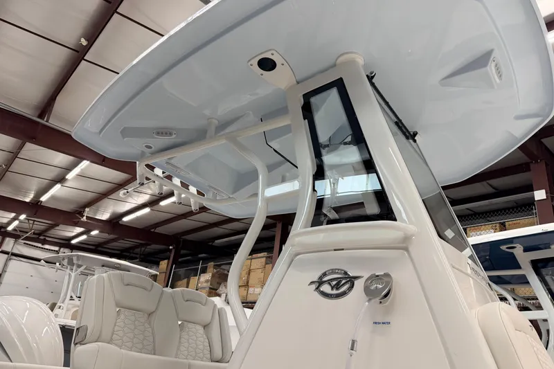 Slide: The Image of 2026 Tidewater 232 LXF boat in showroom. - 7