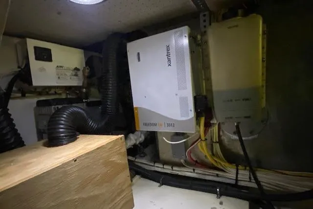 Slide: The Image of Electrical system inside a 1977 Uniflite 42 Convertible boat, featuring Xantrex equipment. - 25
