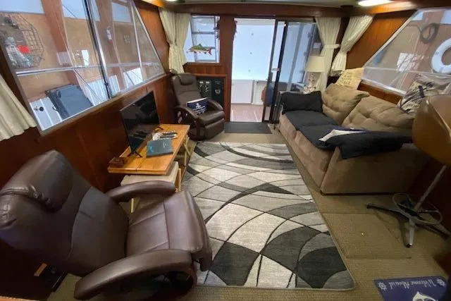 Slide: The Image of 1977 Uniflite 42 Convertible interior with cozy seating and modern decor. - 6