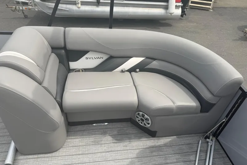 Slide: The Image of Gray seating area on a 2020 Sylvan S3 CRS boat, featuring modern design and speaker integration. - 11