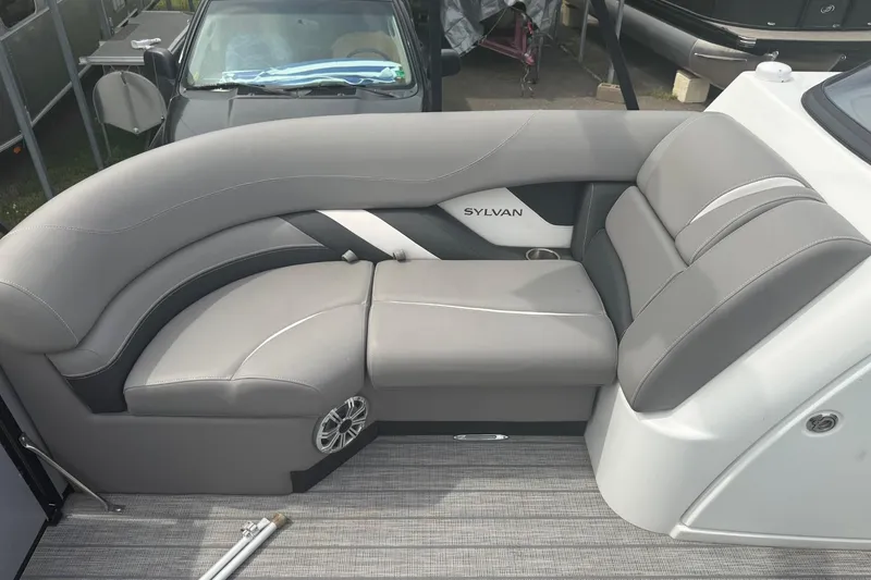 Slide: The Image of Luxurious seating on a 2020 Sylvan S3 CRS boat, featuring sleek gray upholstery. - 12
