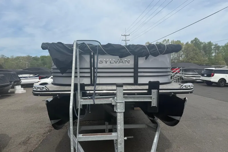 Slide: The Image of 2020 Sylvan S3 CRS pontoon boat on trailer, covered and parked outdoors. - 13